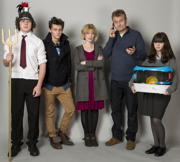 Outnumbered. Image shows from L to R: Ben (Daniel Roche), Jake (Tyger Drew-Honey), Sue (Claire Skinner), Pete (Hugh Dennis), Karen (Ramona Marquez). Copyright: Hat Trick Productions