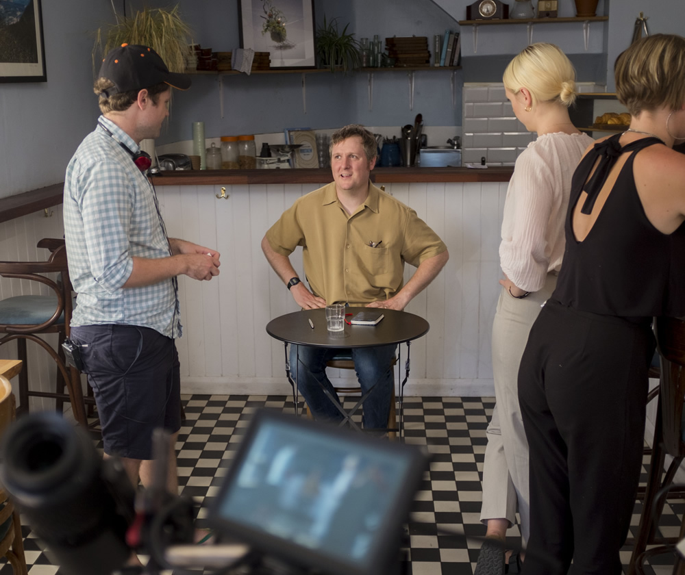 Regular. Image shows from L to R: David Elms, Regular (Tim Key), Barista (Laura Marling)