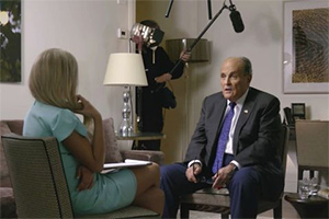 Borat Subsequent Moviefilm. Image shows from L to R: Tutar Sagdiyev (Maria Bakalova), Rudy Giuliani