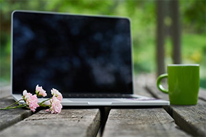 A spring scene with flowers and a laptop computer