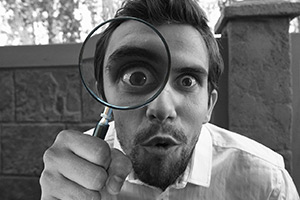 Man holding a magnifying glass