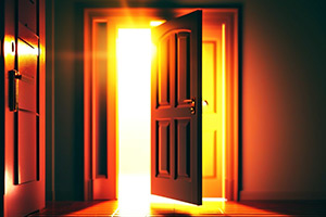 Open door with light behind it