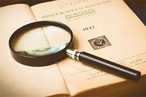 Magnifying glass on an opened book