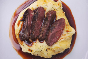 George Egg's Pigeon Breast with Creamed potato and a Beef and Dandelion sauce