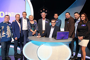 Image shows from L to R: Perry Benson, Richard Gibson, Alexander Armstrong, Kim Hartman, Jeffrey Holland, Richard Osman, Patrick Baladi, Ewen MacIntosh, Abdullah Afzal, Nina Wadia