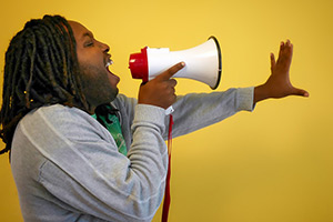 Man shouting in a megaphone