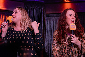 Trusty Hogs at Cheerful Earful Podcast Festival 2023. Image shows left to right: Helen Bauer, Catherine Bohart