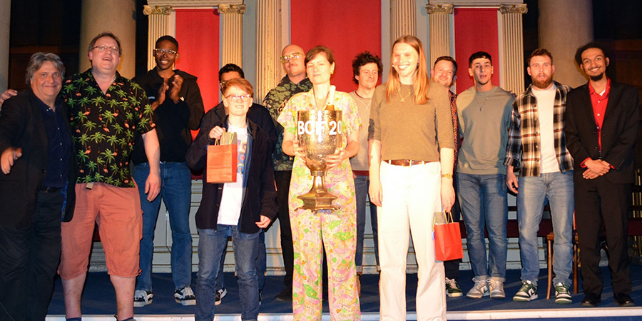 Bath Comedy Festival New Act Competition 2025. Image shows left to right: Alan Francis, Nick Steel, Omari Douglas, Ro Dodgson, Atharva Pharande, Robert Devereux, Madeleine Brettingham, Harrison Thomas, Emma Hughes, Charlie Lewis, Ily Hamdia, Patrick Smith, Carter Seipel. Credit: Adrian Feeney Bath Comedy Festival New Act Competition 2025. Image shows left to right: Alan Francis, Nick Steel, Omari Douglas, Ro Dodgson, Atharva Pharande, Robert Devereux, Madeleine Brettingham, Harrison Thomas, Emma Hughes, Charlie Lewis, Ily Hamdia, Patrick Smith, Carter Seipel. Credit: Adrian Feeney