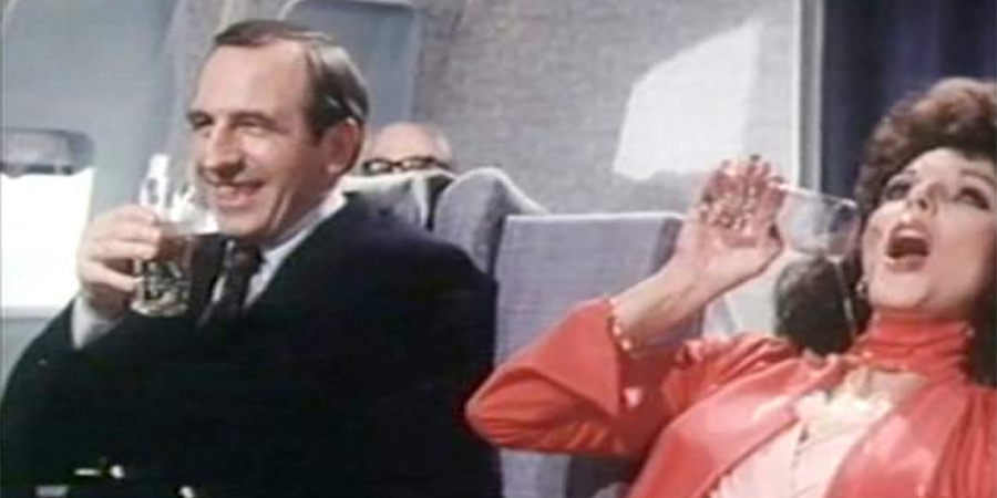 Leonard Rossiter and Joan Collins