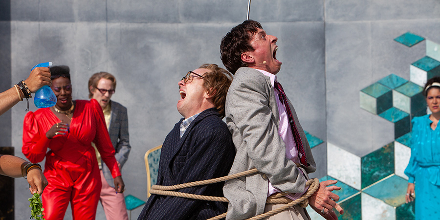 Greg Haiste as Dromio of Ephesus and Rowan Polonski as Antipholus of Ephesus in the Royal Shakespeare Company's production of The Comedy of Errors at the Lydia & Manfred Gorvy Garden Theatre in Stratford-upon-Avon earlier this year. Photo by Pete Le May.. Copyright: Pete Le May