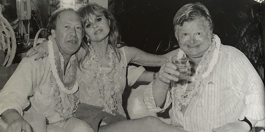 Image shows left to right: Dennis Kirkland, Britt Ekland, Benny Hill