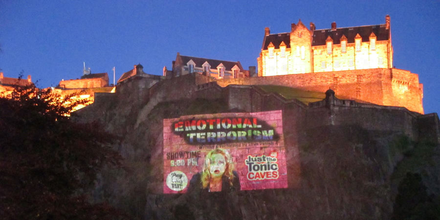 Ellyn Daniels show flyer projected near Edinburgh Castle