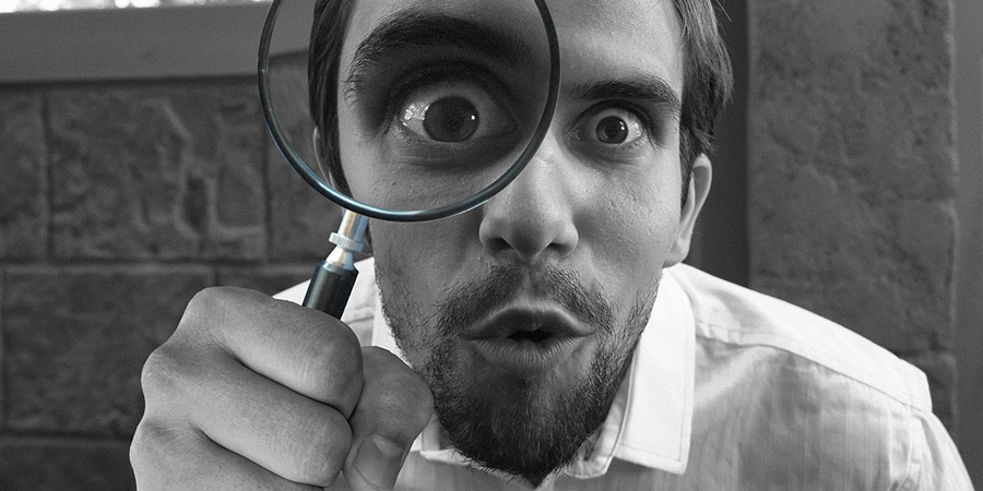 Man holding a magnifying glass