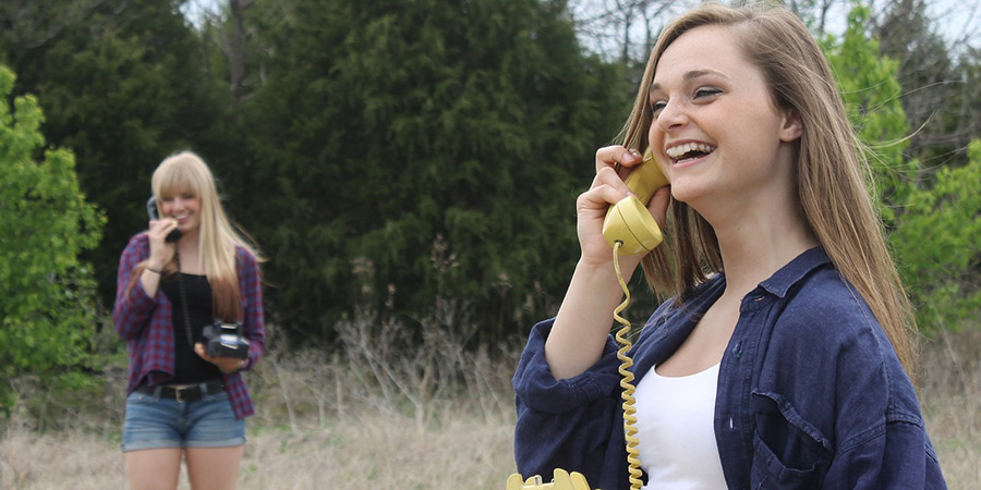 Two women talking on the phone