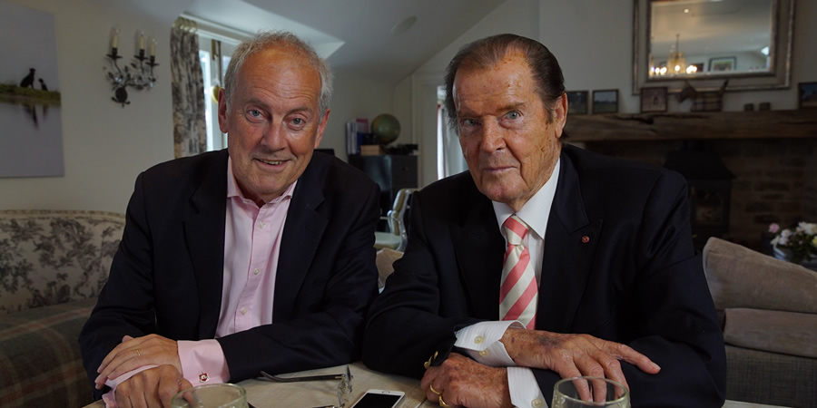 Image shows from L to R: Gyles Brandreth, Roger Moore