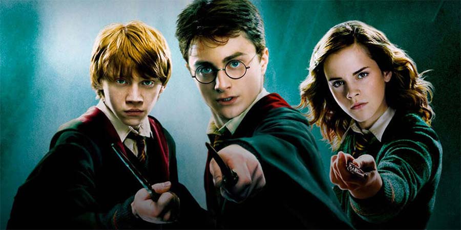 Image shows from L to R: Rupert Grint, Daniel Radcliffe, Emma Watson. Copyright: Warner