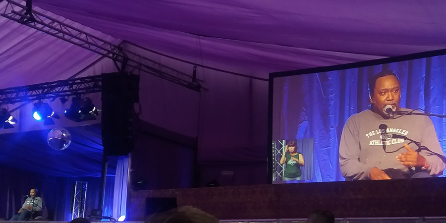 Reginald D Hunter at Latitude Festival 2017 - with a sign language interpreter. Reginald D Hunter. Copyright: Si Hawkins