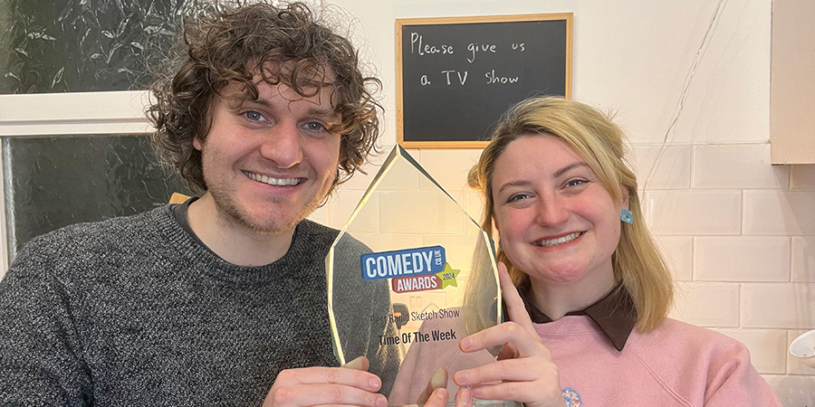 Co-creators Jonathan Oldfield and Lorna Rose Treen with Time Of The Week's award for Best Radio Sketch Show 2024. Image shows left to right: Jonathan Oldfield, Lorna Rose Treen