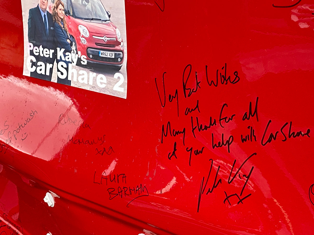 Signed car door close-up on Peter Kay's signature