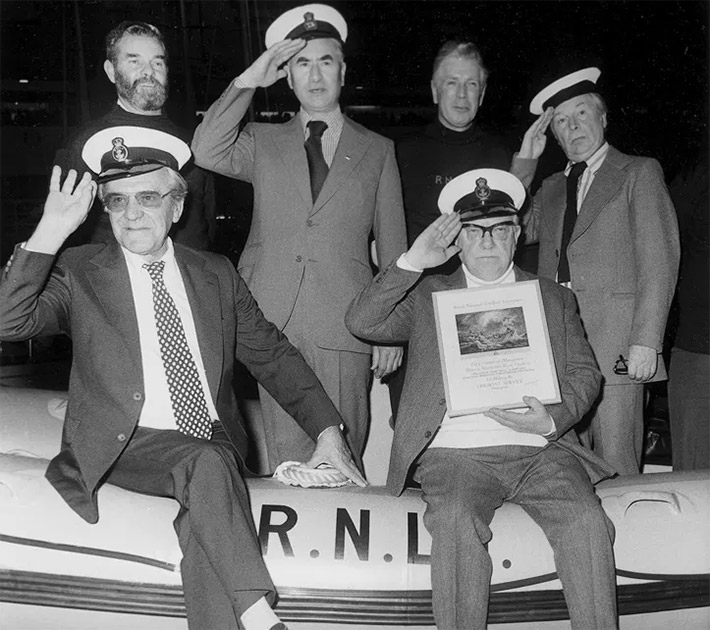 John Le Mesurier, Bill Pertwee, Arthur Lowe and Clive Dunn with two RNLI sailors at the 1977 Boat Show. Image shows from L to R: John Le Mesurier, Bill Pertwee, Arthur Lowe, Clive Dunn