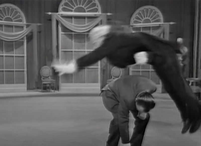 Richard Hearne as Mr Pastry flying over Ed Sullivan's back. Credit: CBS