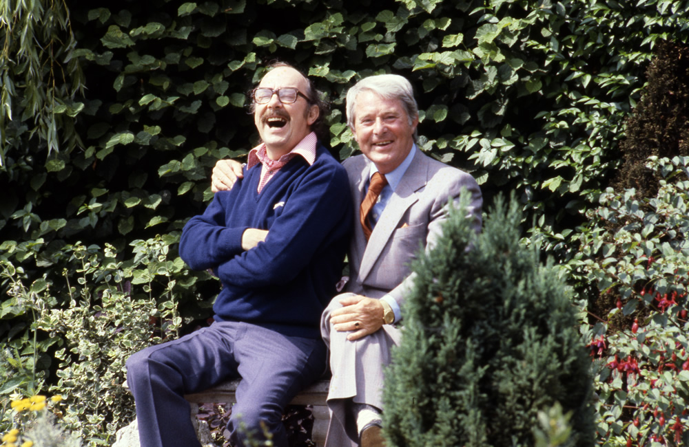 Eric Morecambe and Ernie Wise in the garden of Eric Morecambe's home in Harpenden, 05/08/1979. Image shows from L to R: Eric Morecambe, Ernie Wise. Copyright: BBC History