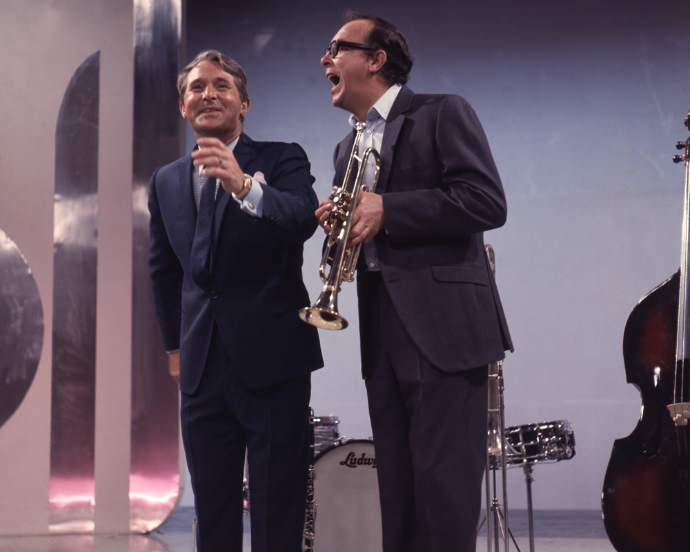 Ernie Wise and Eric Morecambe with a trumpet, 02/09/1968. Image shows from L to R: Ernie Wise, Eric Morecambe. Copyright: BBC History