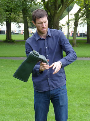 Andrew Bird throwing a welly boot. Andrew Bird